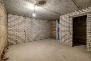 Waterproof wall panel installed in a finished basement.